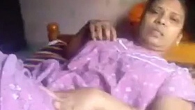 Elderly village woman engages in sexual activity with young man in explicit video