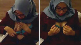 A girl wearing a hijab reveals her big breasts and performs oral sex on her boyfriend