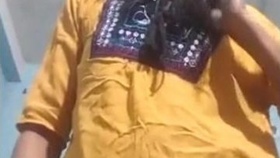 A woman of Indian descent seduces her partner with a performance