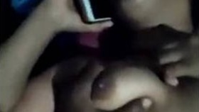 Indian local prostitute chats on the phone