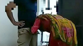 A South Asian woman takes pleasure in performing oral sex on her generously endowed lover