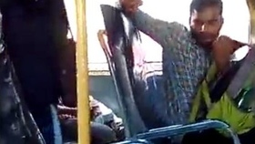 A man masturbates on a public bus while the female conductor records him