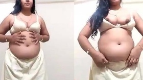 A seductive Indian woman with a curvy figure takes control in a heated scene