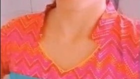 A lovely Indian teenage girl reveals her breasts and vagina