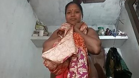 South Indian aunt strips down to reveal her breasts and vagina