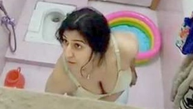 Indian village sister bathes and urinates while her mom watches