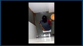 Secretly filmed women engage in intimate activities in bathroom