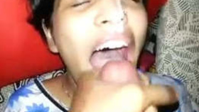 Indian wife in traditional attire skillfully performs oral sex