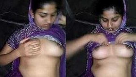 Desi beauty reveals her curves and squeezes her breasts