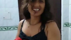 Desi bhabhi takes a bath and pleasures herself by talking