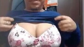 A lovely girl with big boobs reveals her intimate parts