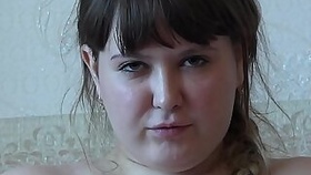 A fat girl in pantyhose smokes and then masturbates