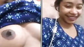 Joyful Desi camgirl lifts up dress and shows natural XXX breasts