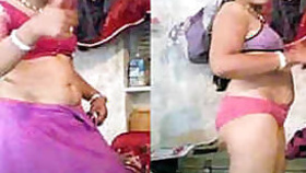 Smiling Indian woman strips down to her underwear in solo video