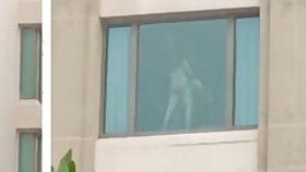Couple caught shagging in a hotel, captured by people outside