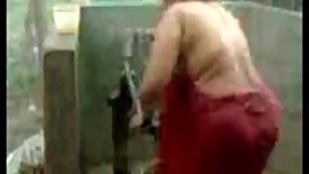 fat Indian bhabha showers at the pump